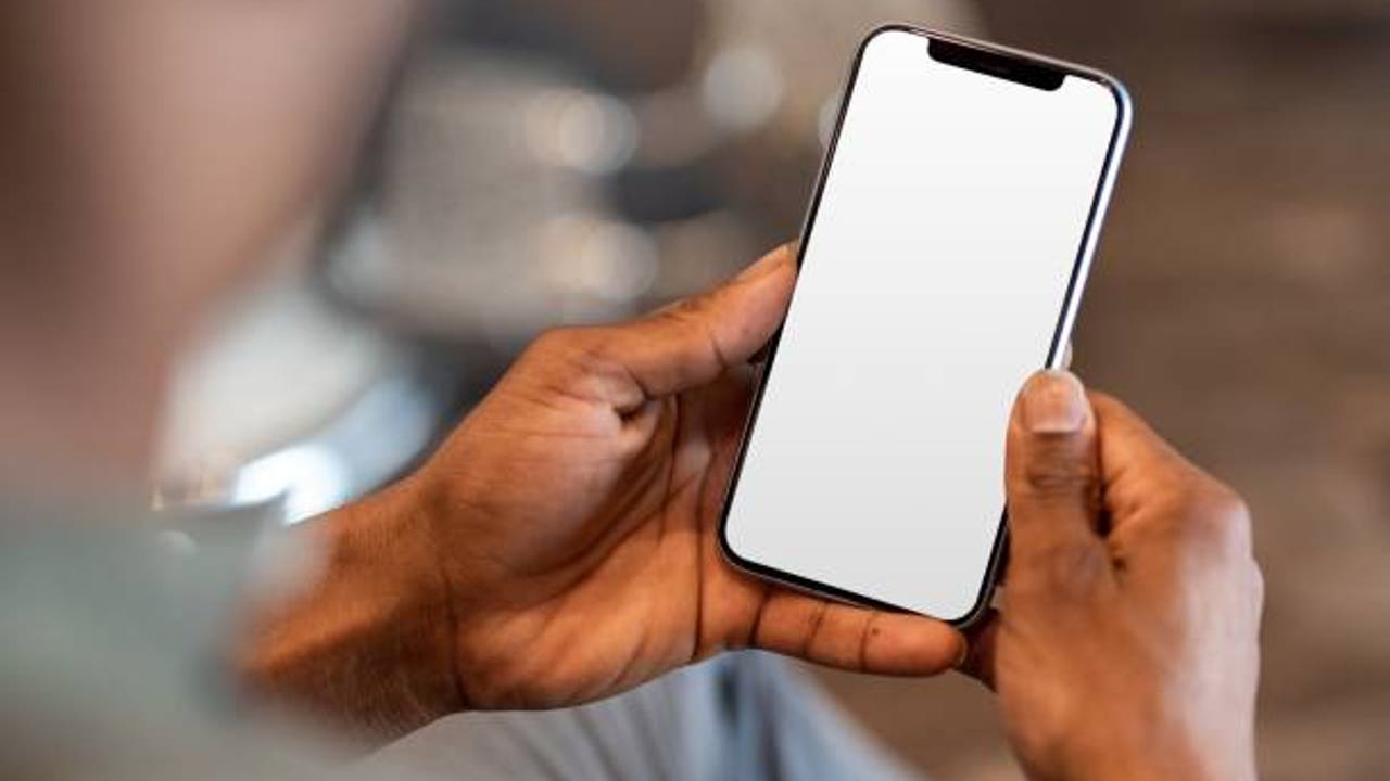 What is the small round hole that mobiles have next to the entrance of the charger?